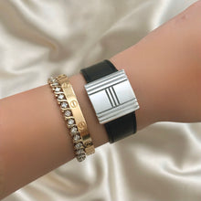 Load image into Gallery viewer, VINTAGE HERMÈS HIDDEN DIAL BLACK LEATHER WATCH